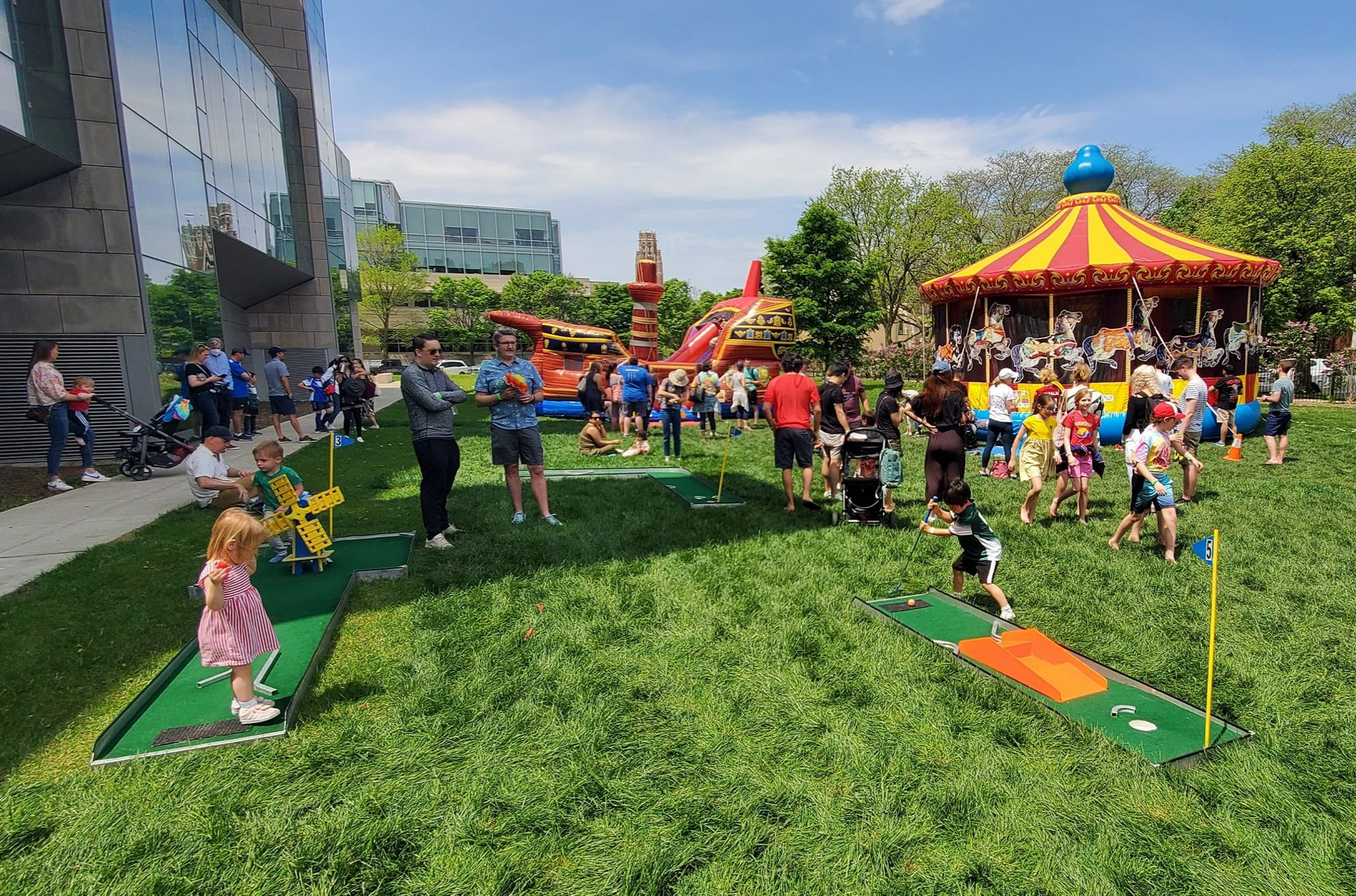 Vibrant outdoor school carnival event with games and inflatables in Chicagoland